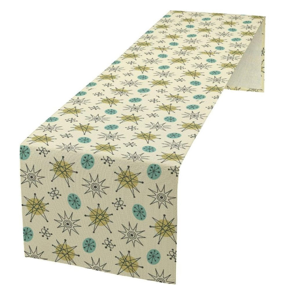 Sailorine pale table runner with a repeating green and blue starburst pattern