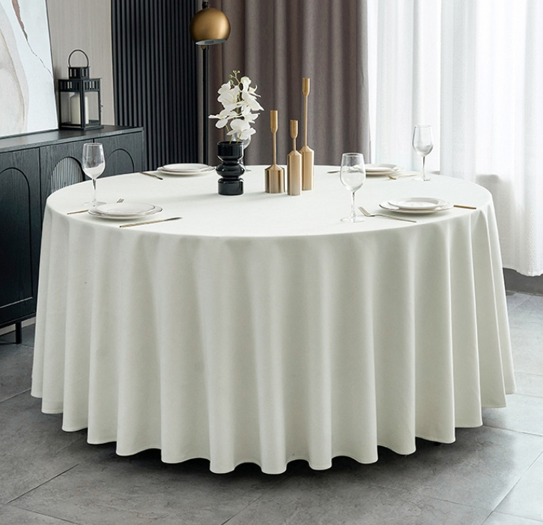 Sailorine white round tablecloth on a set dining table