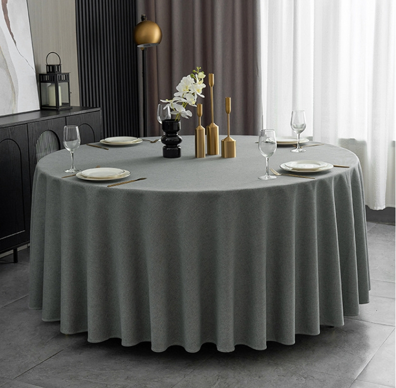 Sailorine dark gray round tablecloth with plates and glassware