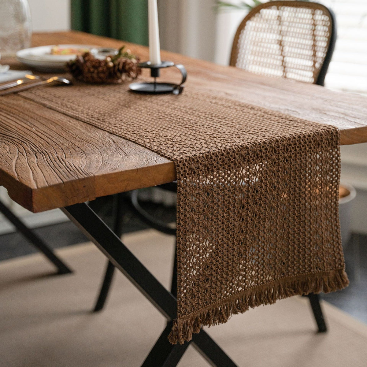 Sailorine brown woven table runner draped over a wooden table
