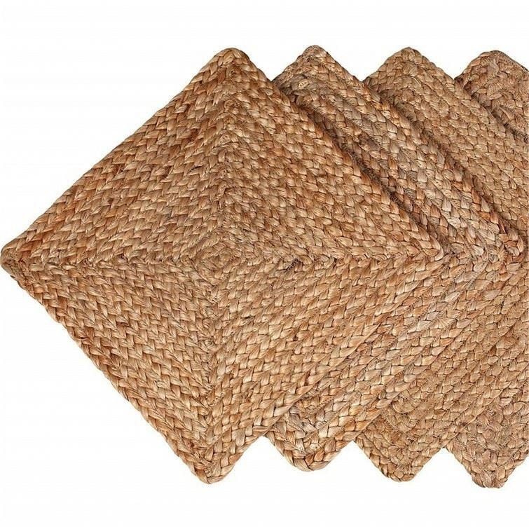 Sailorine brown woven rectangular placemats overlapping on a white background