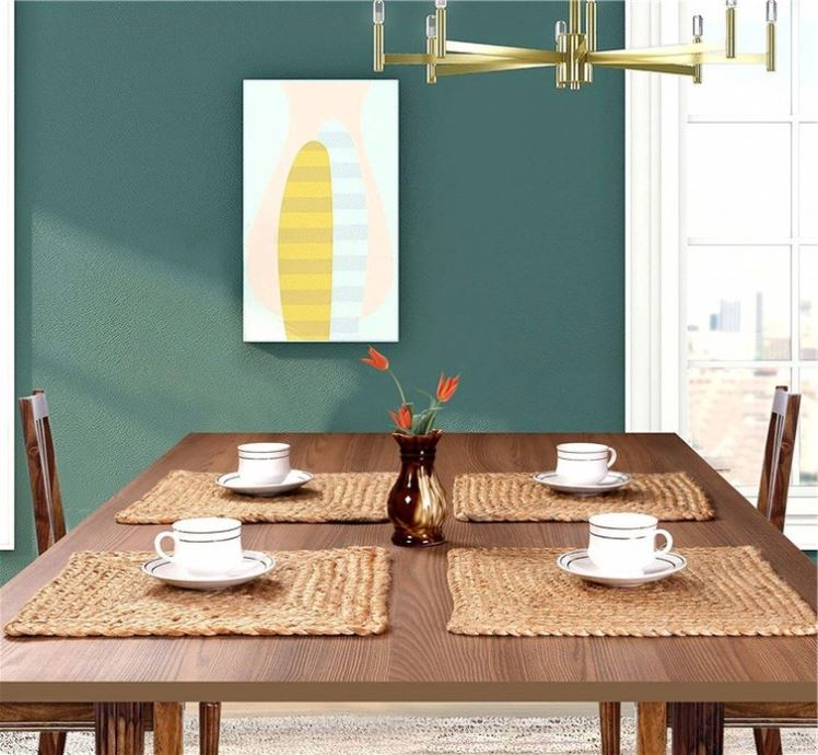 Sailorine woven placemats arranged on a dining table with white cups